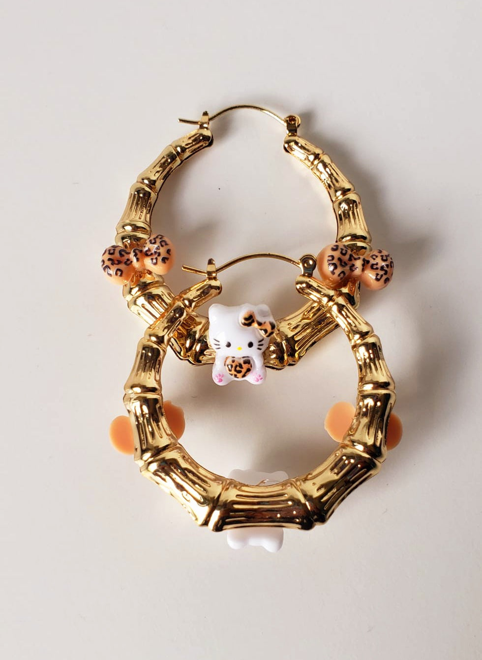 Gold-plated Hoop Earrings HK with Charms and Bows