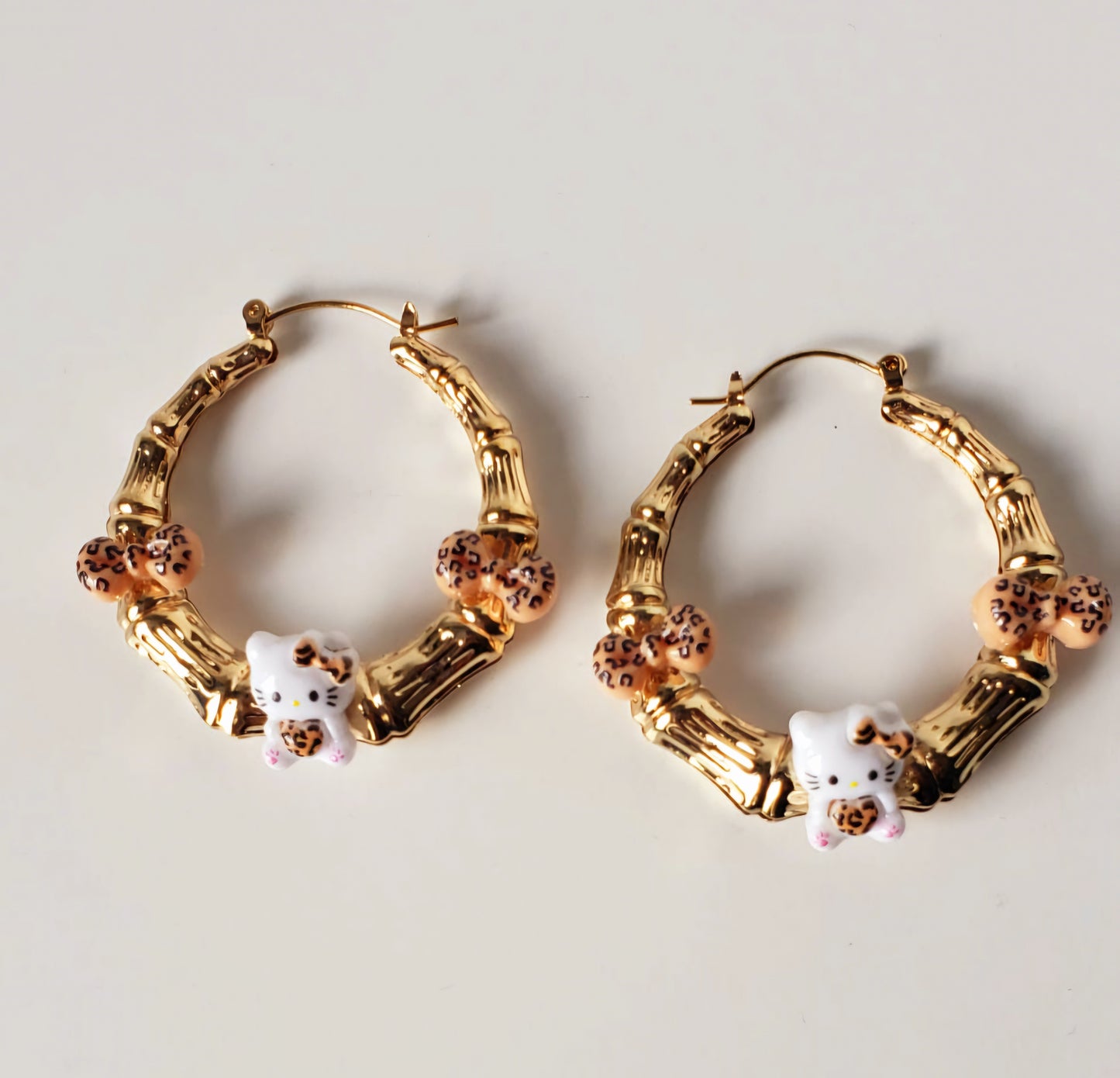 Gold-plated Hoop Earrings HK with Charms and Bows